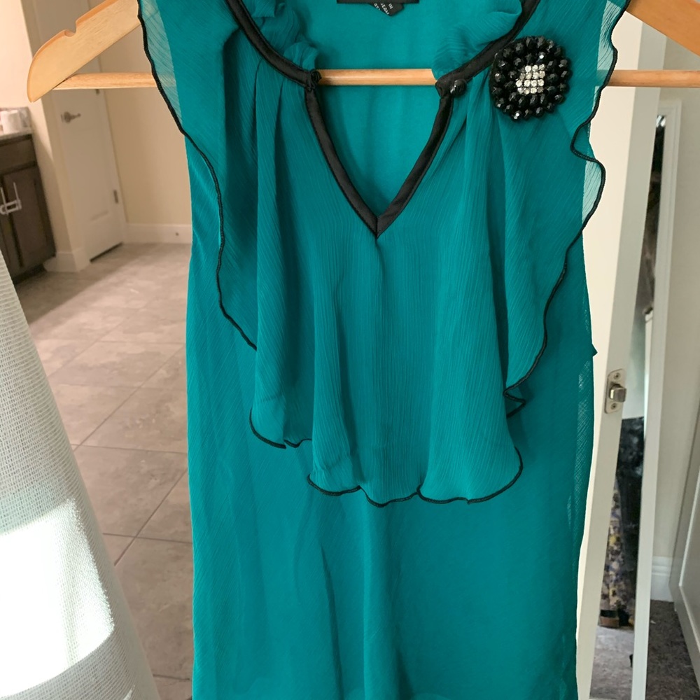 Green and black chiffon shirt.